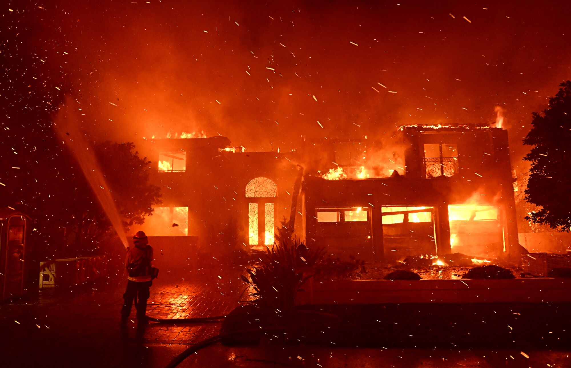 Embers rain down on firefighters battling the Coastal fire in the Coronado Pointe community in Laguna Niguel.