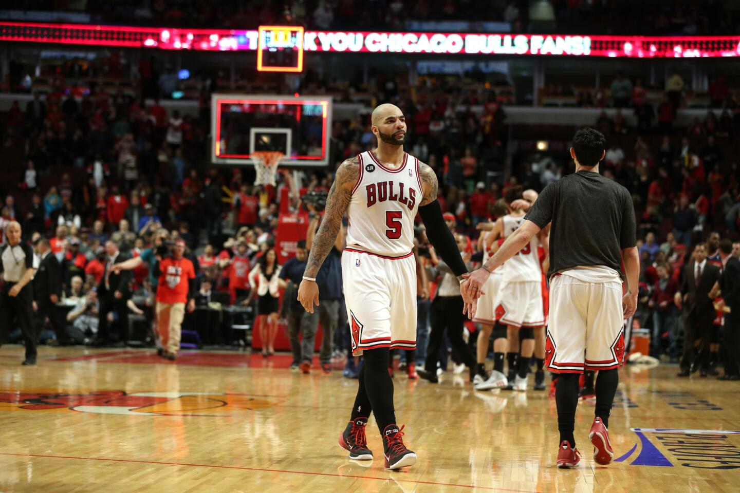 Carlos Boozer walks off the floor after losing Game 5 to the Wizards in the playoffs.