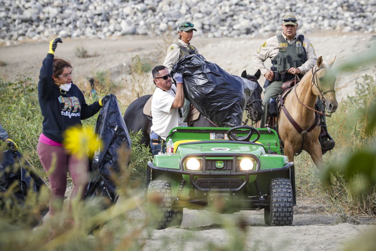 Local volunteers participate in the cleanup effort during National Public Lands Day.