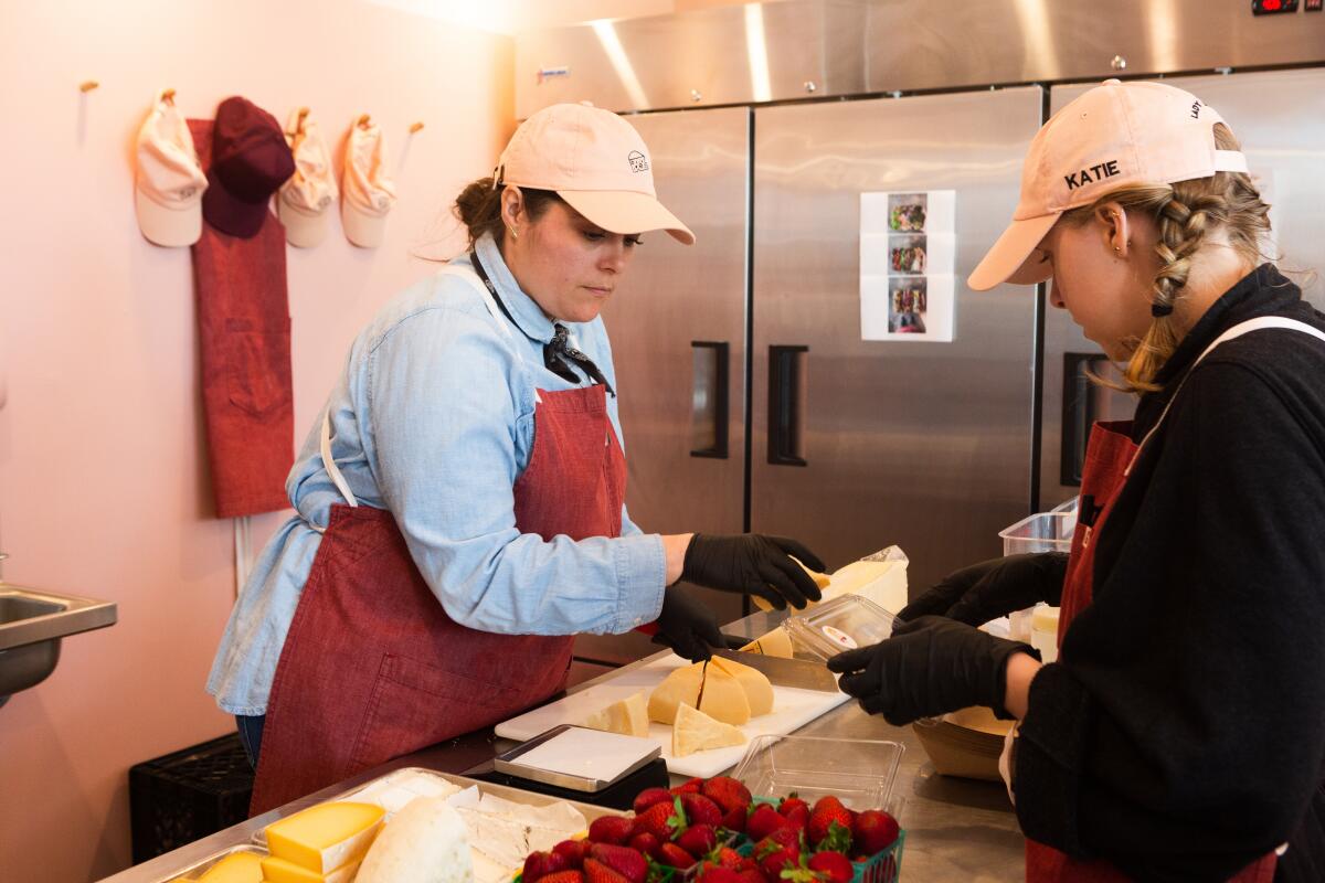 Sarah Hendrix, left, owner of Lady & Larder, works on an order with Kate Miller. 