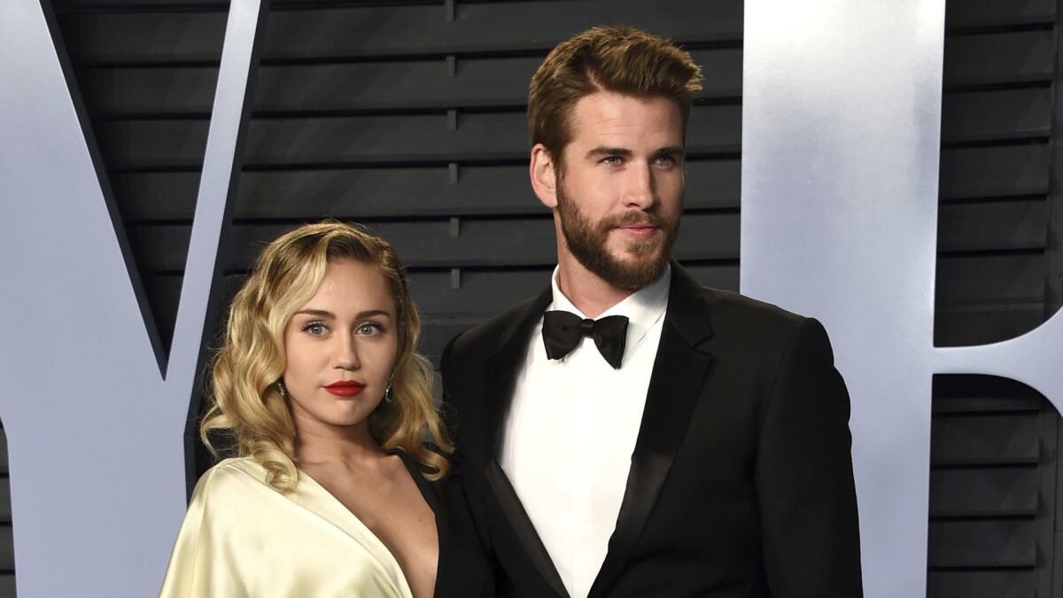 Miley Cyrus and Liam Hemsworth at Vanity Fair's 2018 Oscar party.