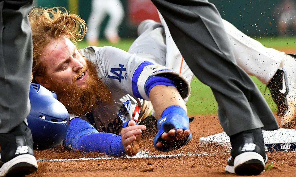 Justin Turner is tagged out at third base on a failed sacrifice bunt from Enrique Hernandez in the seventh. (Wally Skalij / Los Angeles Times)