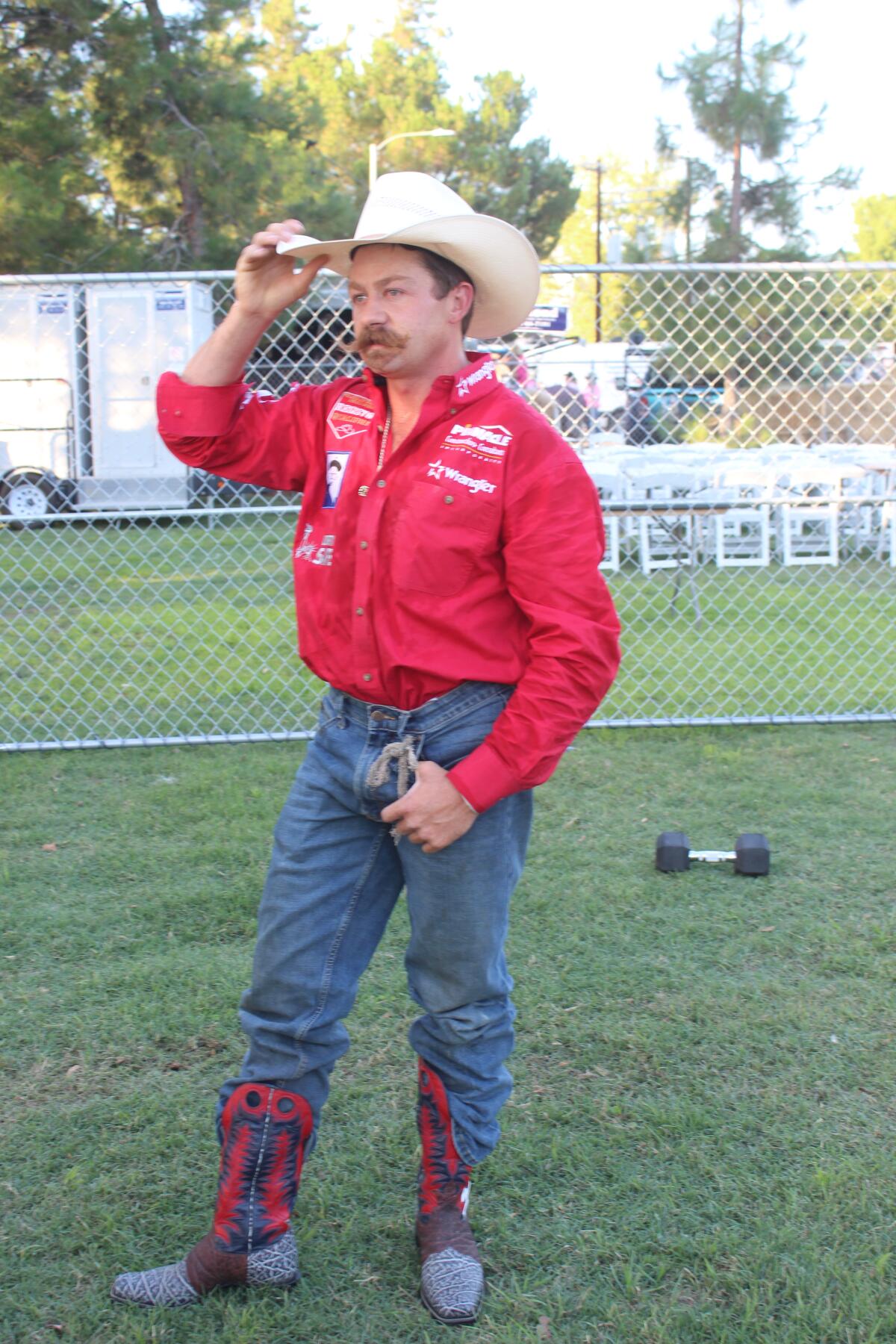 Bareback bronco rider Wyatt Denny was the first cowboy out of the gate on opening night of the Ramona Rodeo.