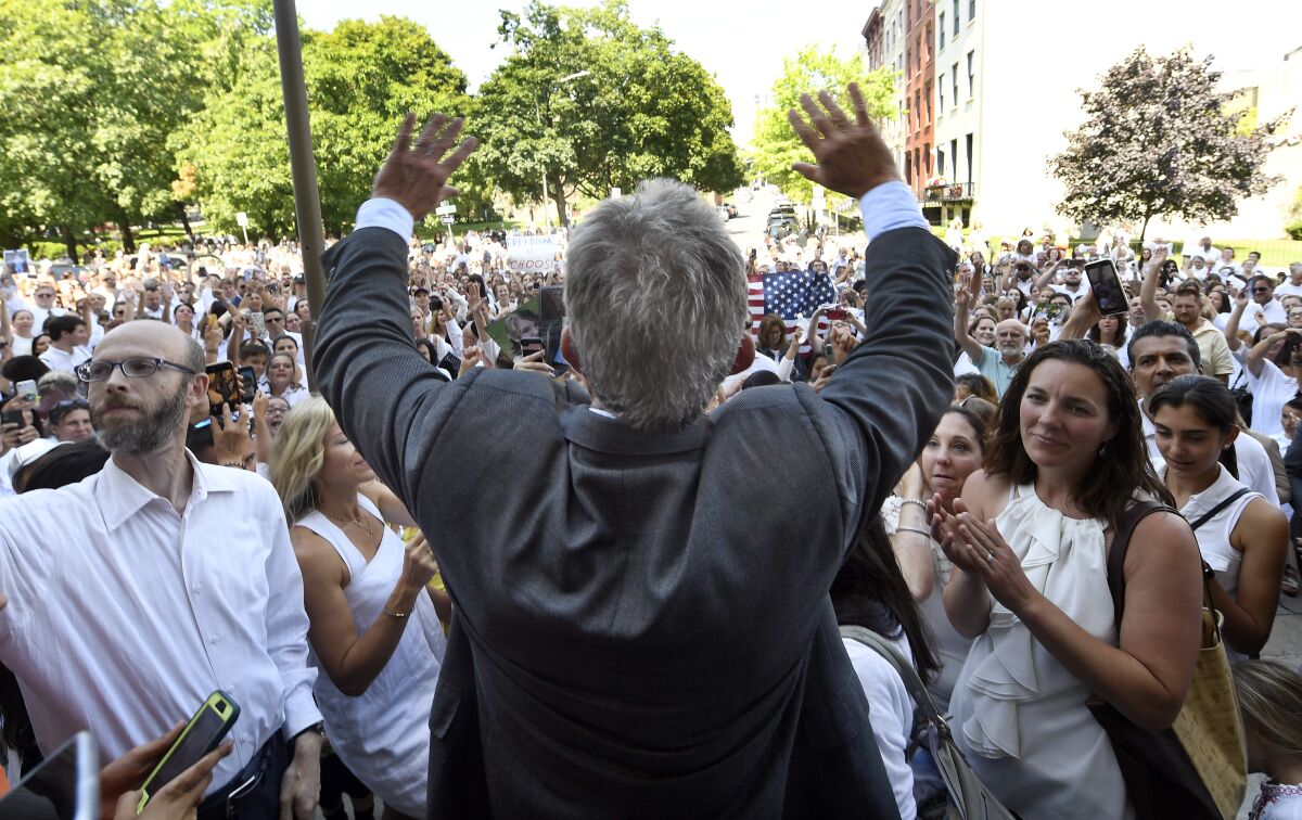 FILE - Robert F. Kennedy, Jr. speaks at a rally outside the Albany County Courthouse Wednesday, Aug. 14, 2019, in Albany, N.Y., following a hearing about vaccine religious exemptions. An investigation by The Associated Press finds that Children’s Health Defense has raked in money and followers as Kennedy used his star power as a member of one of America’s most famous families to open doors, raise money and lend his group credibility. (AP Photo/Hans Pennink, File)