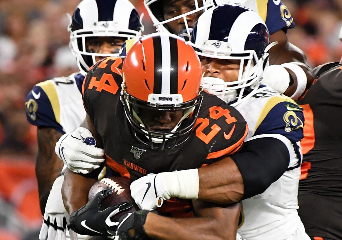 Rams defensive tackle Aaron Donald tackles Cleveland Browns running back Nick Chubb.
