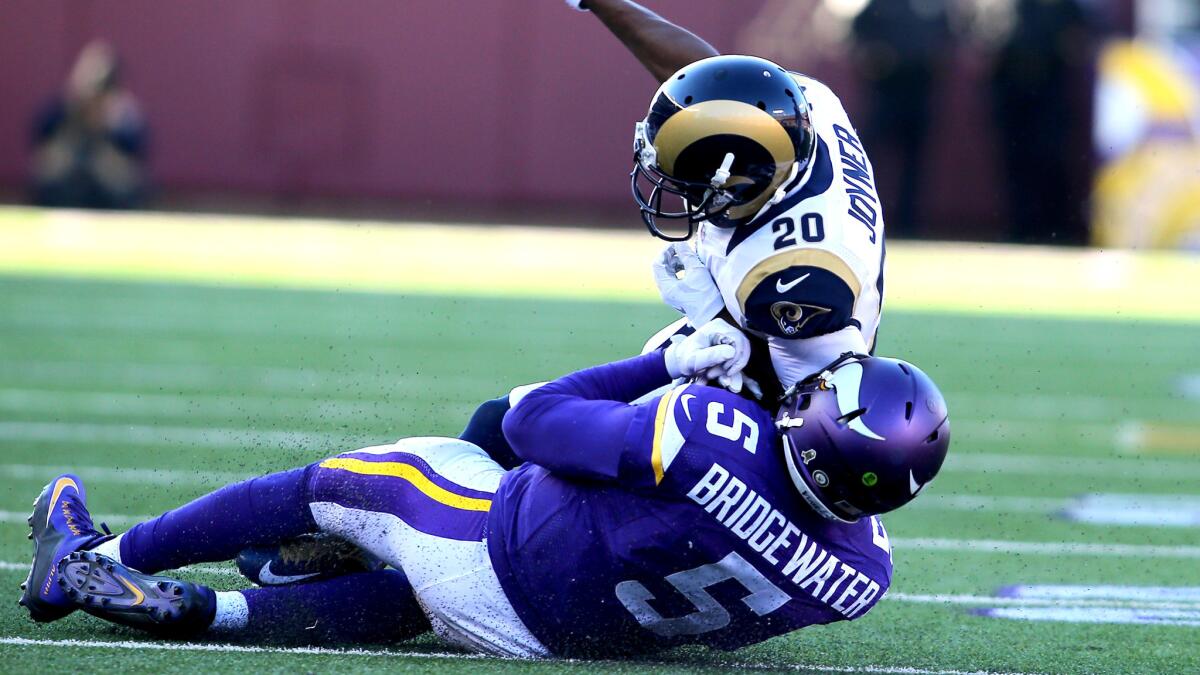 Rams cornerback Lamarcus Joyner brings down Vikings quarterback Teddy Bridgewater during a game last season.