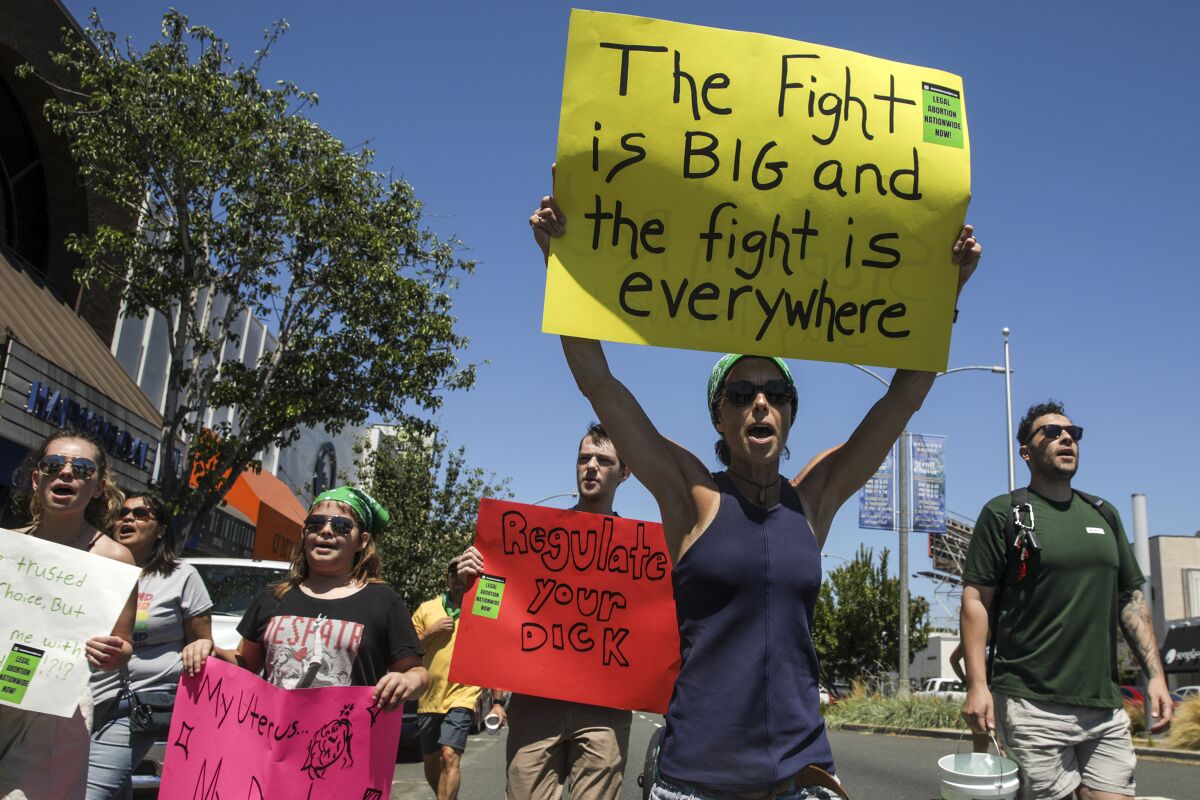 Hundreds march for abortion rights in Long Beach, CA, after Roe vs. Wade was overturned. (Irfan Khan / Los Angeles Times)