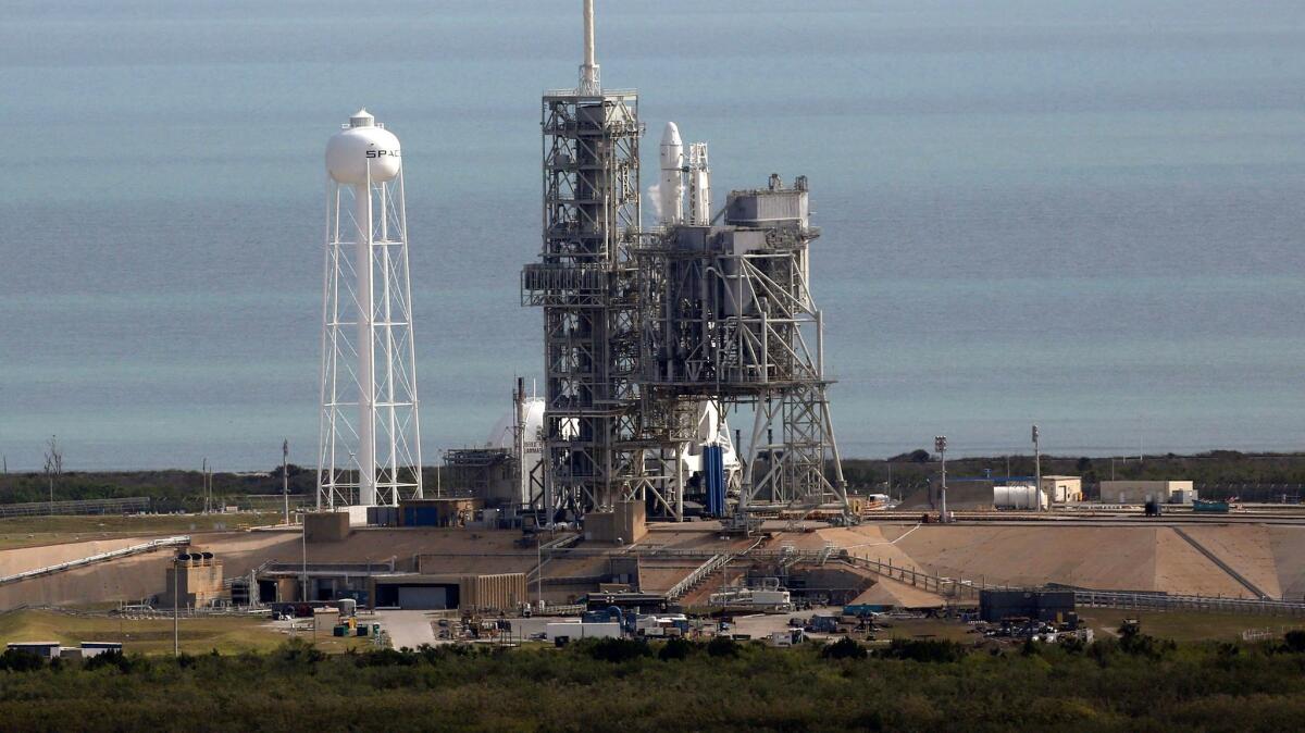 The SpaceX Falcon 9 rocket sits on the launch pad at the Kennedy Space Center in Cape Canaveral, Fla., on Feb. 18.