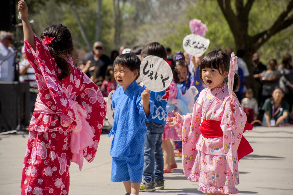 Costumed children perform on the main stage at the 2019 Orange County Cherry Blossom Festival.