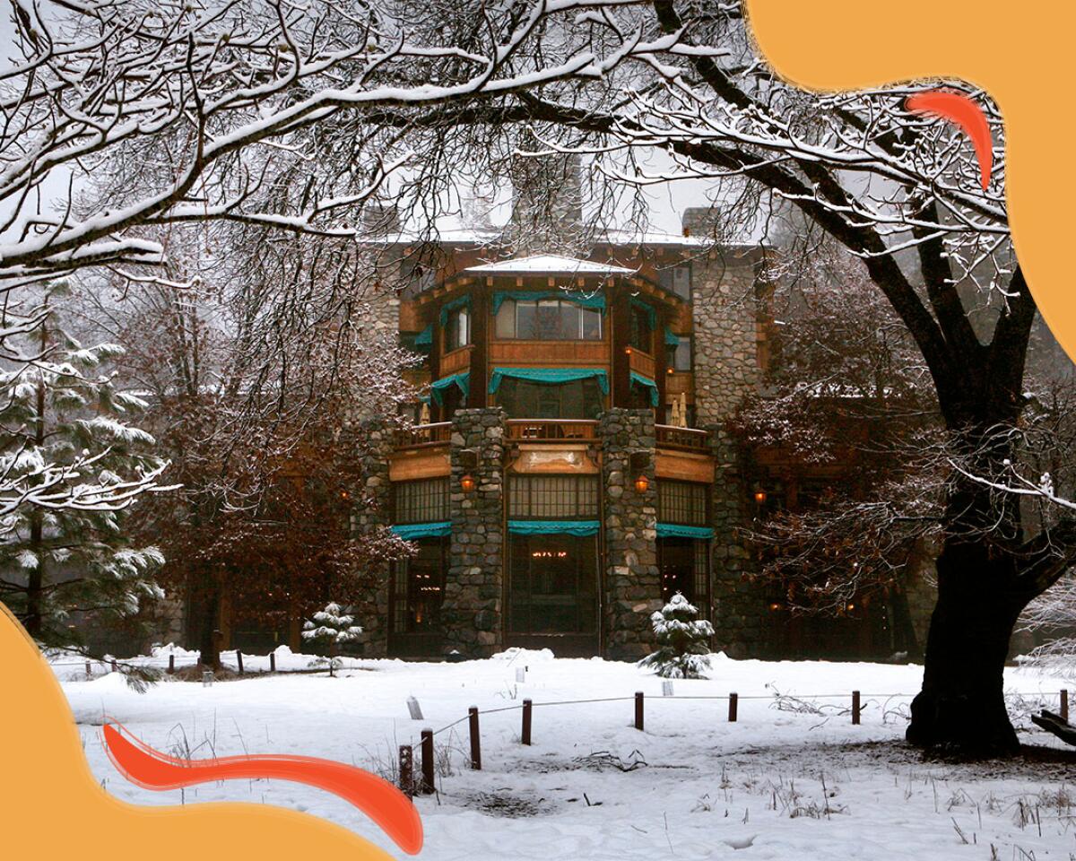 The front of a multistory building surrounded by trees and grounds covered in snow.