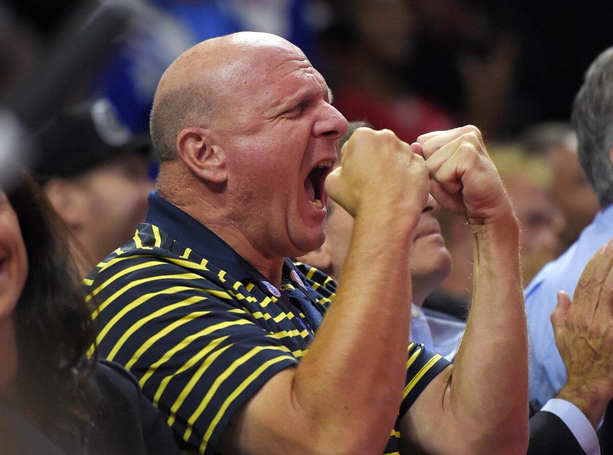 Clippers owner Steve Ballmer displays some emotion as he is shown on the big screen at Staples Center during the Clippers' preseason game against Phoenix on Wednesday.