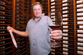 Urban Press Winery owner Giovanni D'Andrea shows off his barrel 2015 Merlot at the winery's location, 316 N. San Fernando Rd., in Burbank, on Friday, April 28, 2017. The portfolio includes white, red, rosé, sparkling and dessert wines.