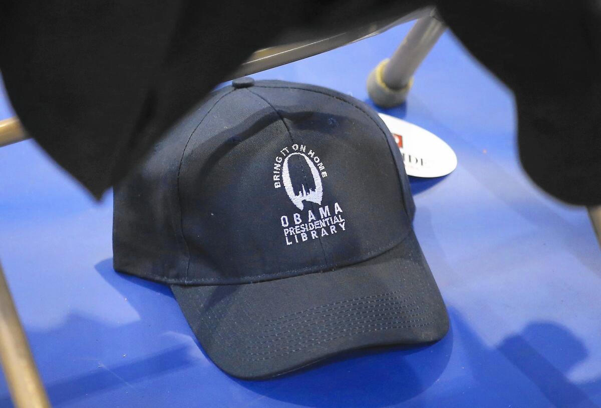 A cap design promotes Chicago as the destination for the Obama presidential library.