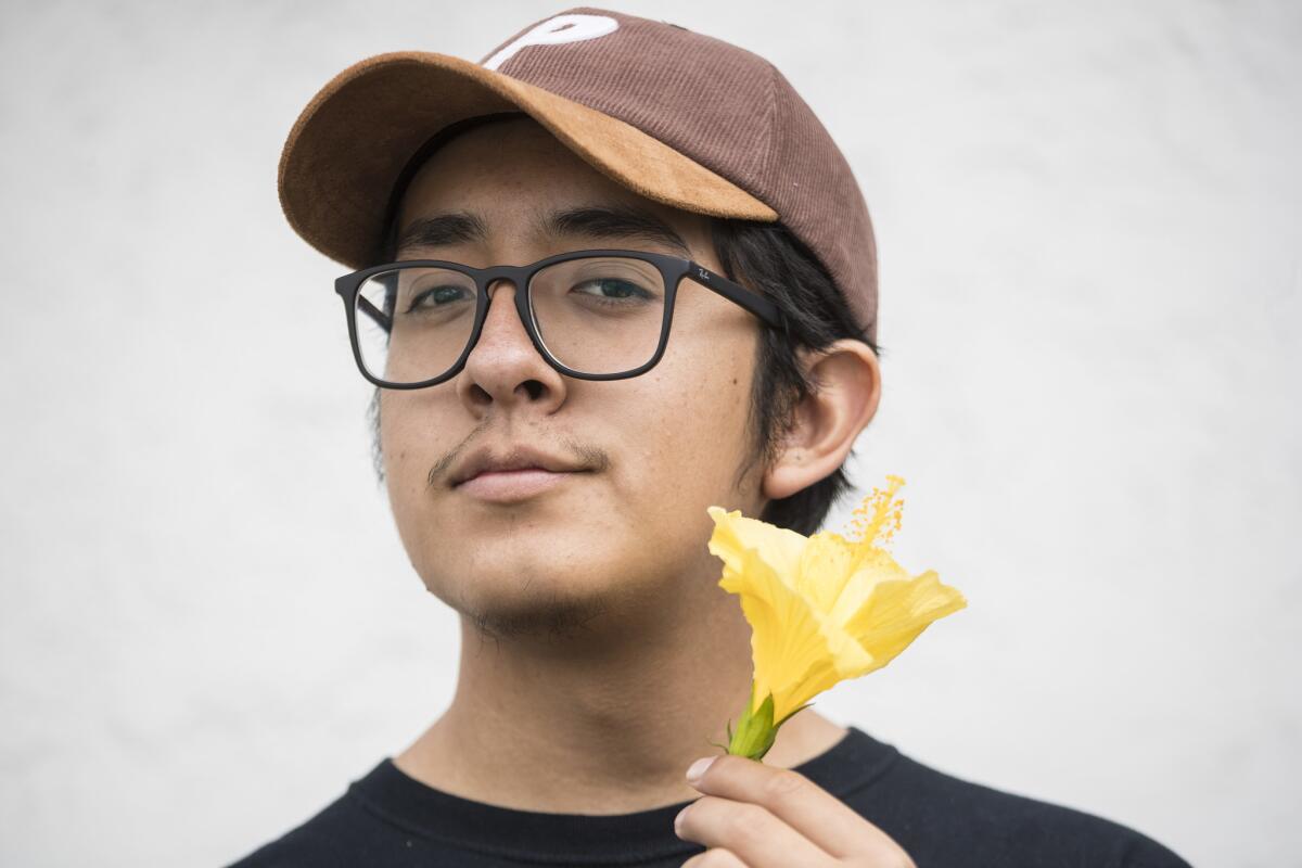 Teenage Chicano heartthrob Omar Banos, who performs as Cuco, poses for photographs near his home in Hawthorne.