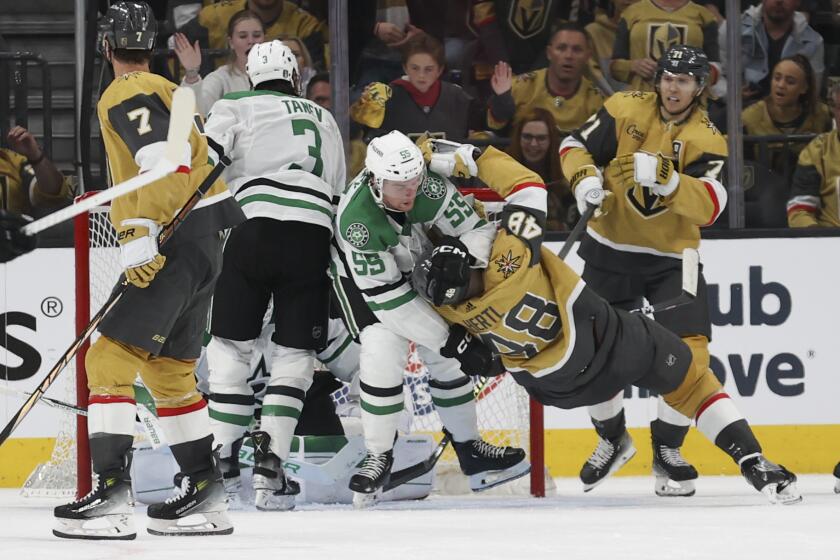 Dallas Stars defenseman Thomas Harley (55) throws Vegas Golden Knights center Tomas Hertl (48) to the ice during the third period in Game 3 of an NHL hockey Stanley Cup first-round playoff series Saturday, April 27, 2024, in Las Vegas. (AP Photo/Ian Maule)