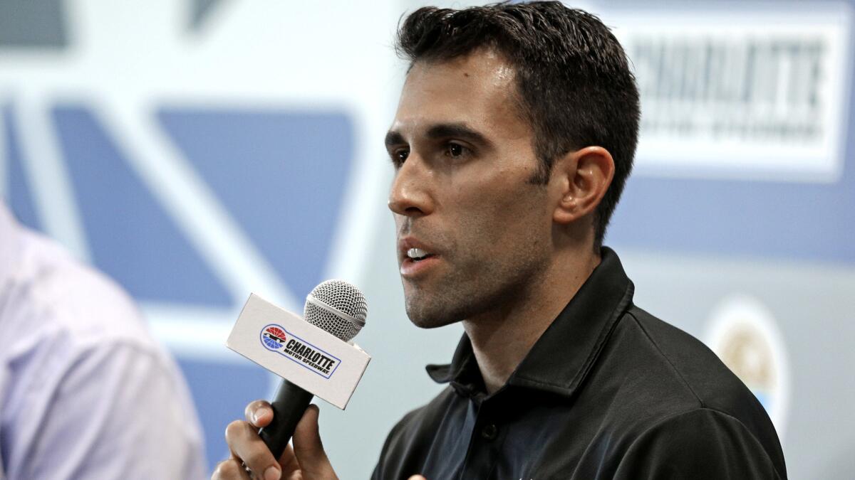 Aric Almirola addresses the media during a news conference Friday