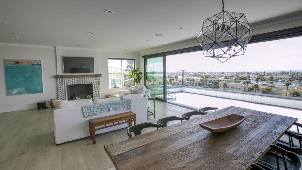 The view from the main room of Trever and Chelsea Gregory’s home overlooks Newport Bay. The home will be on display for the Newport Harbor Home Tour.