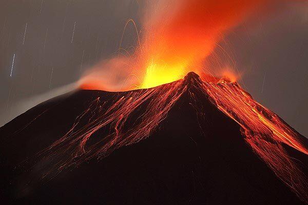 The Tungurahua volcano spews smoke and lava. The volcano, one of Ecuador's most active, has awoken after six months of calm.