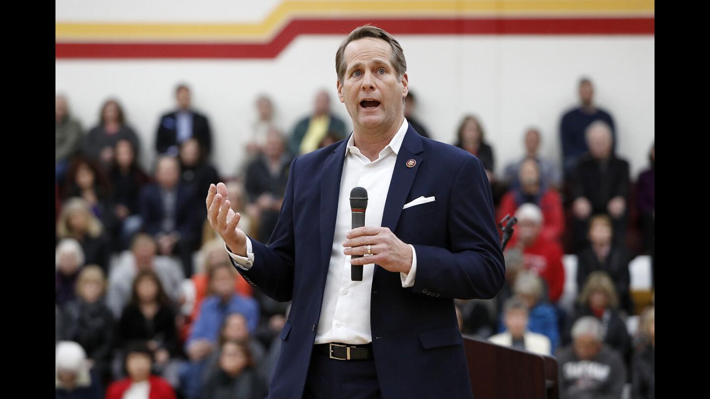 Rep. Harley Rouda (D-Laguna Beach) addresses his constituents during his first district town hall meeting in the gym at Estancia High School in Costa Mesa on Tuesday.