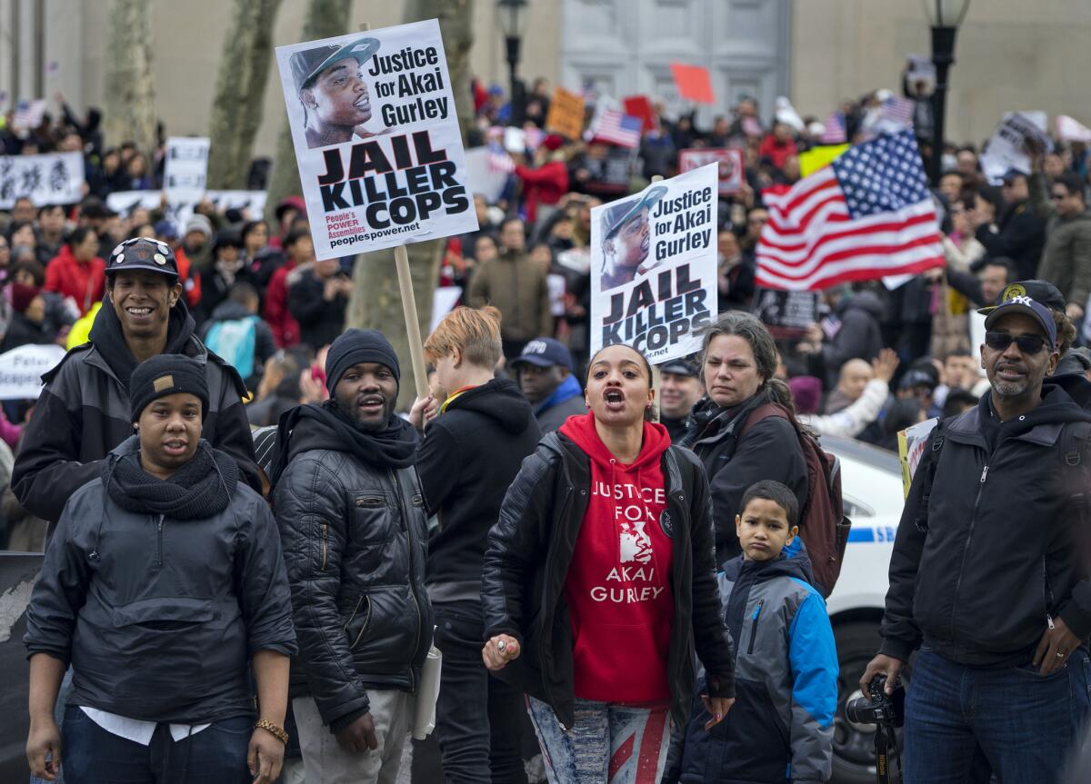 Counter-protesters exchange words with protesters attending a rally in Brooklyn on Saturday in support of former NYPD Officer Peter Liang.