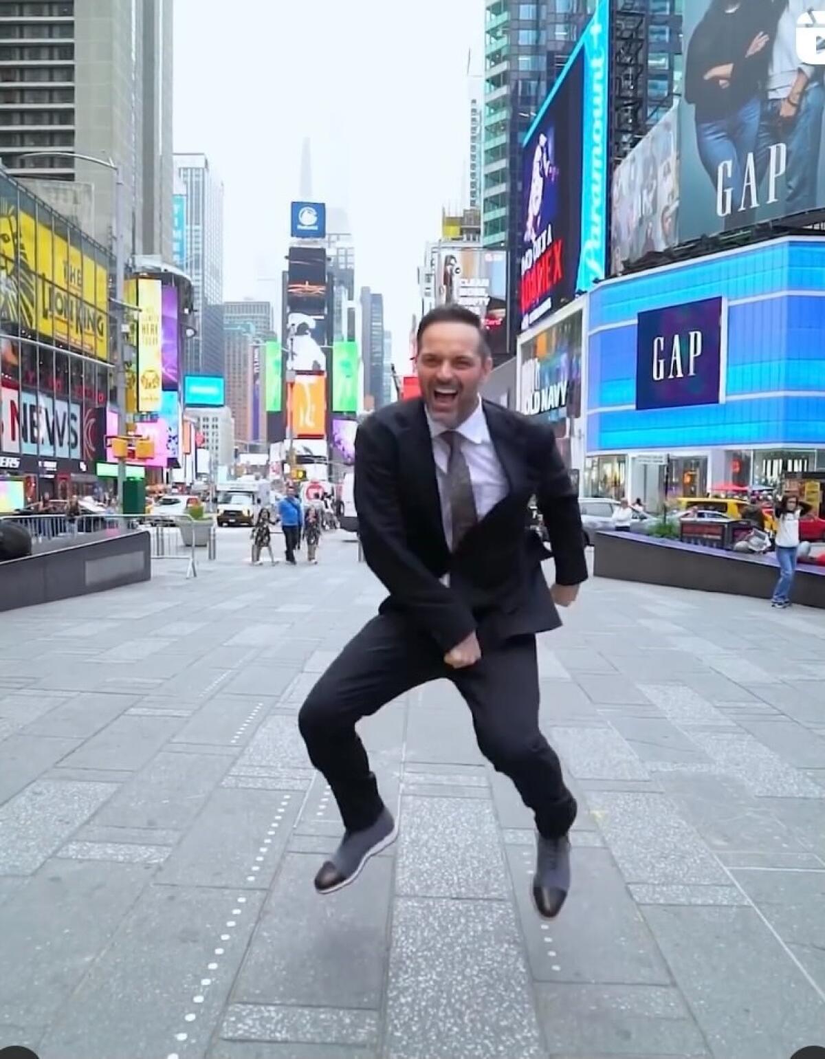 A man dances in New York's Times Square.