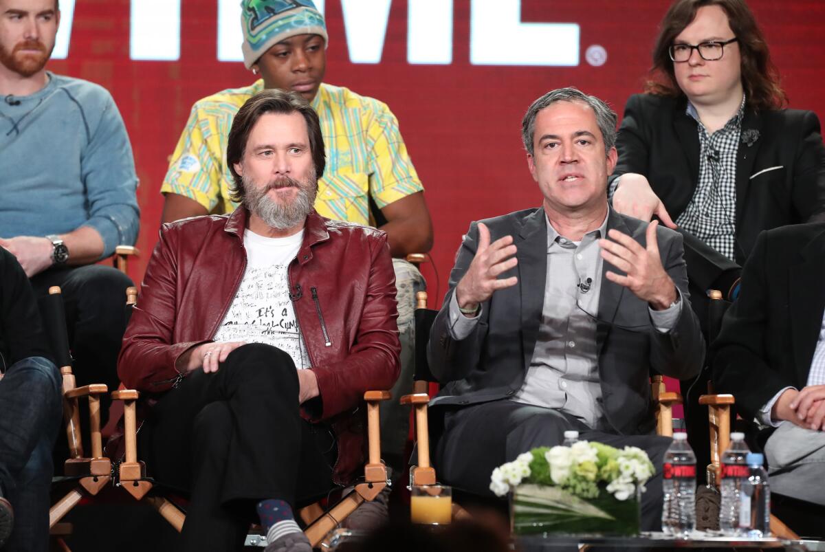 Actors Andrew Santino, RJ Cyler and Clark Duke, back row, with executive producers Jim Carrey and Michael Aguilar of Showtime's "I'm Dying Up Here" at the winter TCA Press Tour. (Frederick M. Brown / Getty Images)