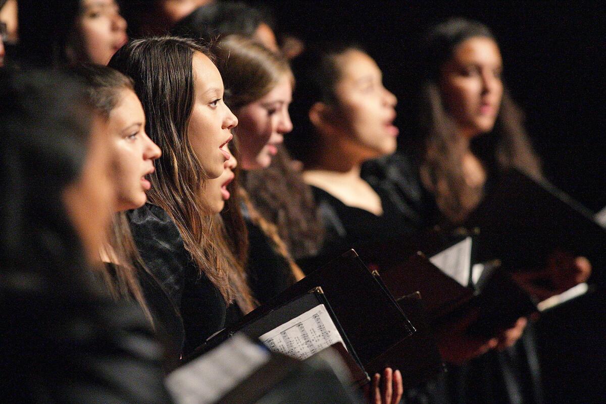 Isabella Imperial, center, sings with the the Glendale High School A Capella Choir at the 15th annual Armenian Genocide commemoration at Glendale High School on Wednesday, April 20, 2016.