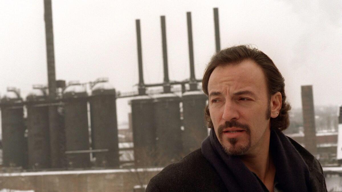 Bruce Springsteen stands in front of the "Jenny," a shut-down steel furnace in Youngstown, Ohio, on Jan. 13, 1996.