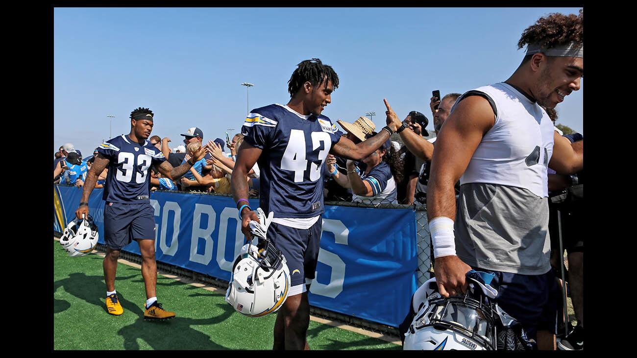 Glendale High School graduate Michael Davis, #43, greets fans as he comes in for his second season as defensive back with the Los Angeles Chargers football team, at Jack Hammett Sports Complex, in Costa Mesa on Saturday, July 28, 2018.