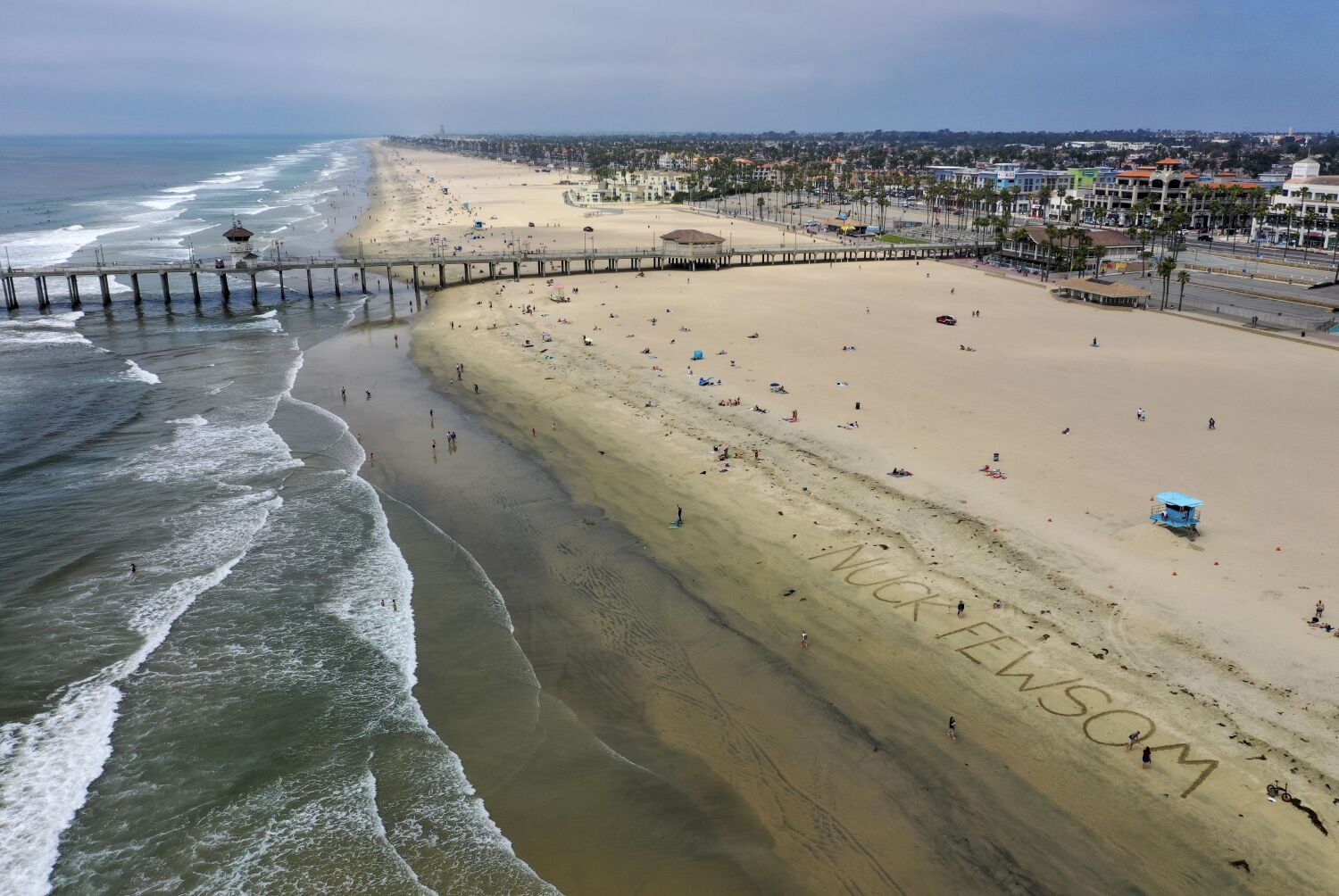 Huntington Beach officials clear waters and beach due to oil-like 'sheen'