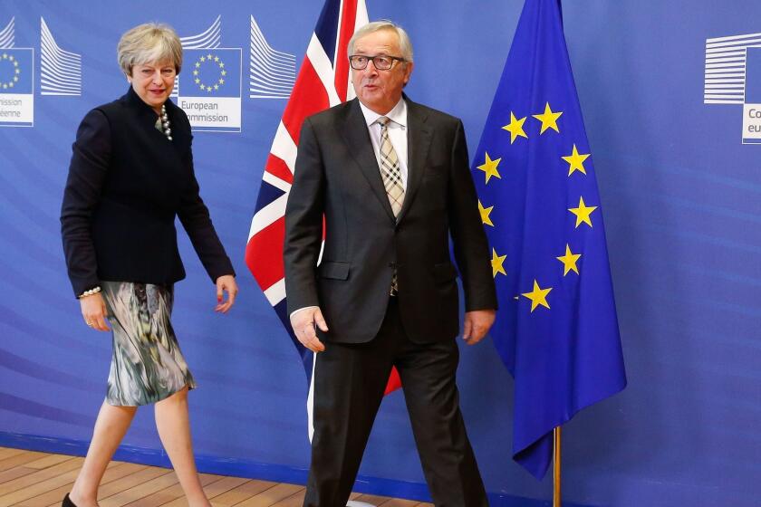 Mandatory Credit: Photo by JULIEN WARNAND/EPA-EFE/REX/Shutterstock (9255328g) Theresa May and Jean-Claude Juncker Brexit negotiations, Brussels, Belgium - 04 Dec 2017 British Prime Minister Theresa May (L) is welcomed by EU Commission President Jean-Claude Juncker (R) prior to a meeting at the EU Commission in Brussels, Belgium, 04 December 2017. ** Usable by LA, CT and MoD ONLY **