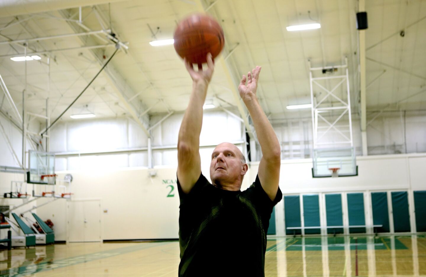 Clippers owner Steve Ballmer shoots free throws during his workout at Pro Sports Club in Bellevue, Wash.