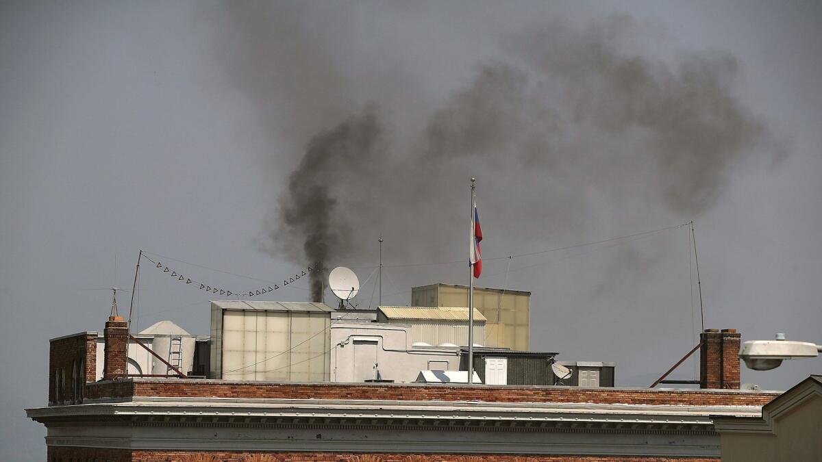 Black smoke billows from a chimney on top of the Russian Consulate in San Francisco on Sept. 1.