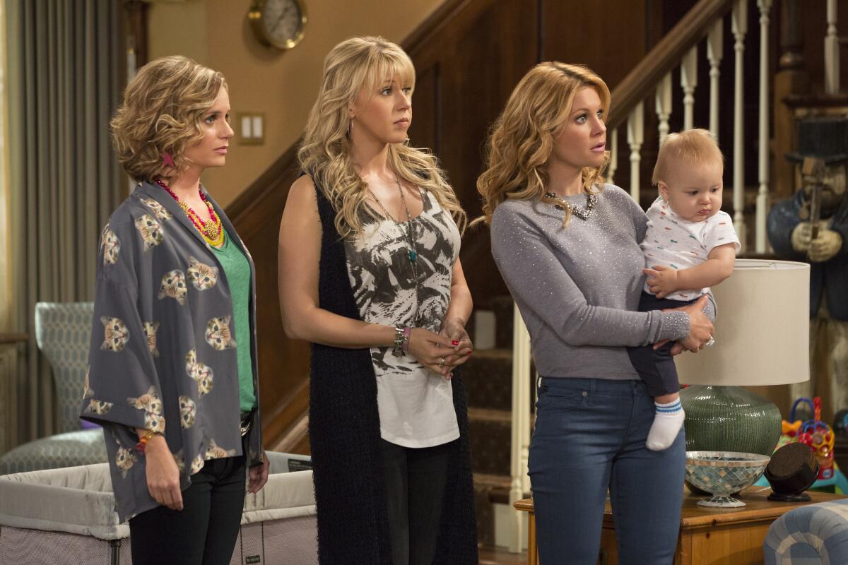 Andrea Barber, left, Jodie Sweetin and Candace Cameron Bure are back in "Fuller House," streaming on Netflix beginning Friday.