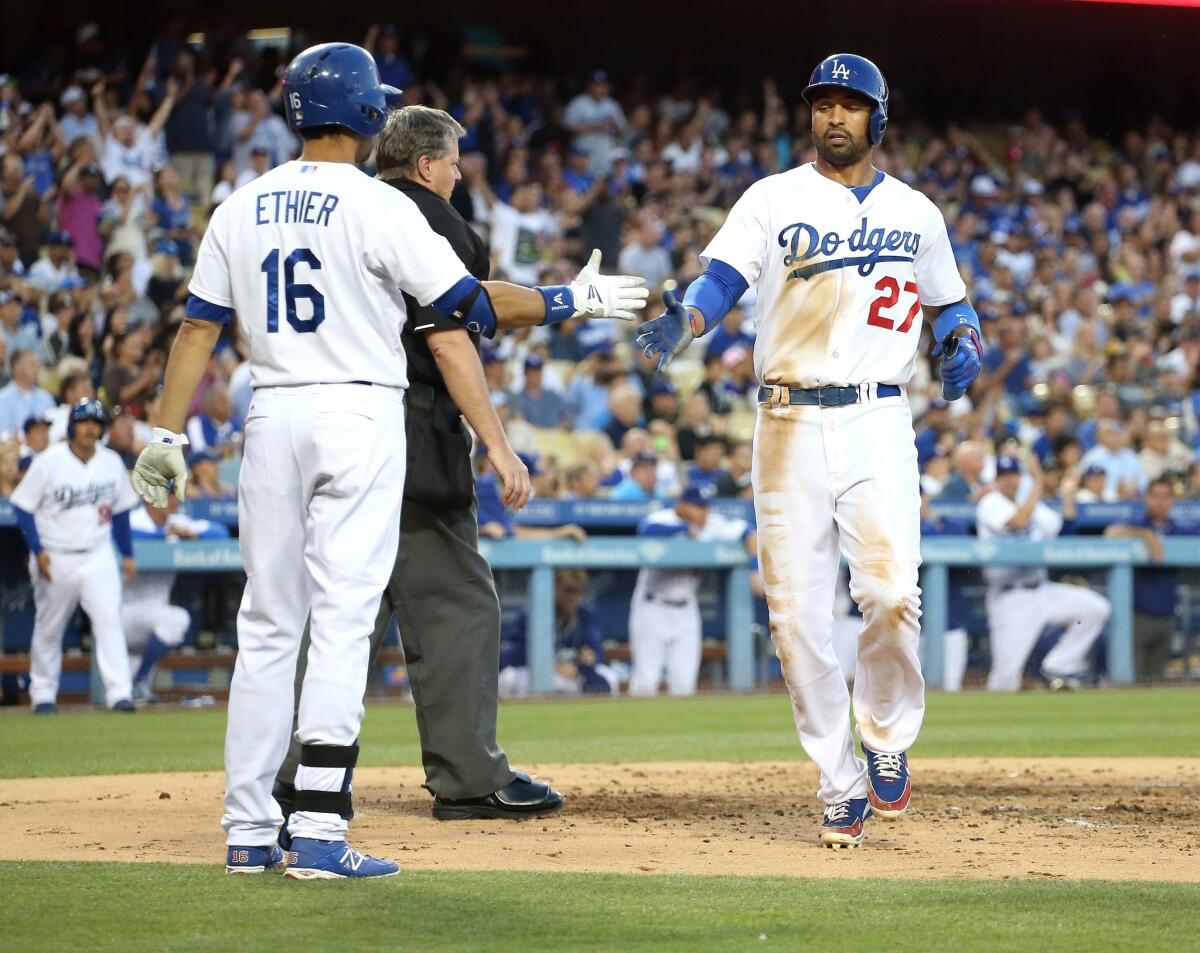 Matt Kemp scores the Dodgers' lone run against the White Sox on a sacrifice fly in the second inning of Tuesday's 4-1 loss to Chicago.