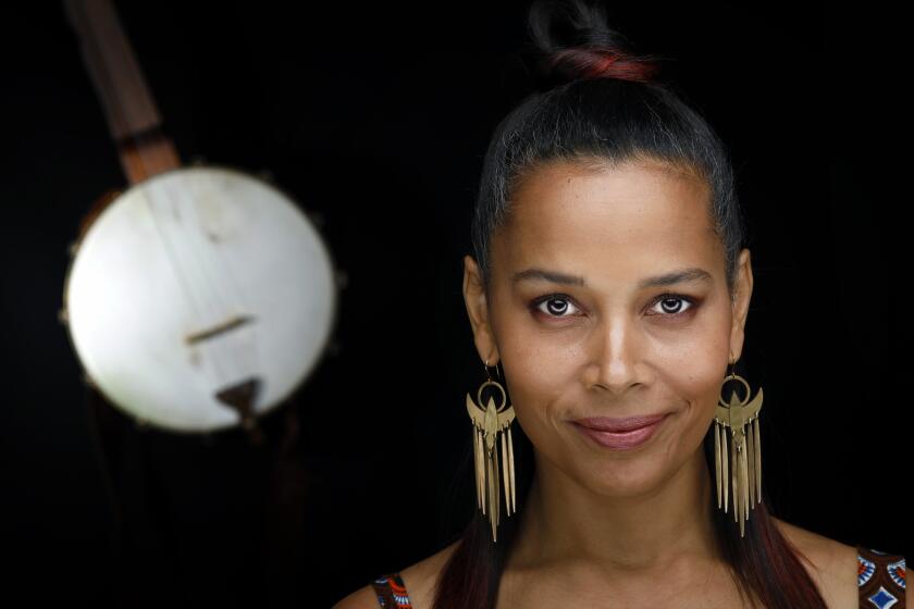 NEW YORK, N.Y. -- MONDAY, SEPTEMBER 16, 2019 -- Rhiannon Giddens, a singer, banjo player and violinist, takes part in Ken Burns new 8-part, 16-hour documentary "Country Music". Giddens is also a founding member of the Carolina Chocolate Drops. Giddens recently released her latest album "there is no Other" which features Italian instrumentalist Francesco Turrisi. ( Rick Loomis / for the Los Angeles Times ) Assignment ID: 3073944