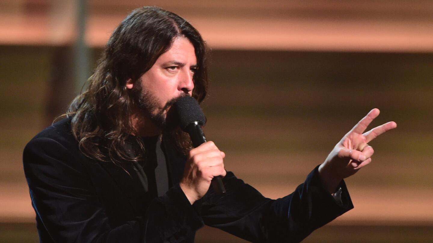 Musician Dave Grohl takes the stage.