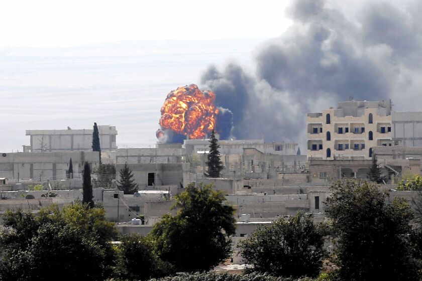 Smoke rises in the Syrian town of Kobani, during fighting against Islamic State militants.