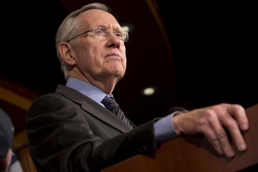 Senate Majority Leader Harry Reid of Nev. pauses during a news conference on Capitol Hill in Washington, Thursday, Nov. 21, 2013, after the Democrat majority in the Senate pushed through a major rules change, one that curbs the power of the Republican minority to block President Barack Obama's nominations for high-level judgeships and cabinet and agency officials. (AP Photo/Jacquelyn Martin)