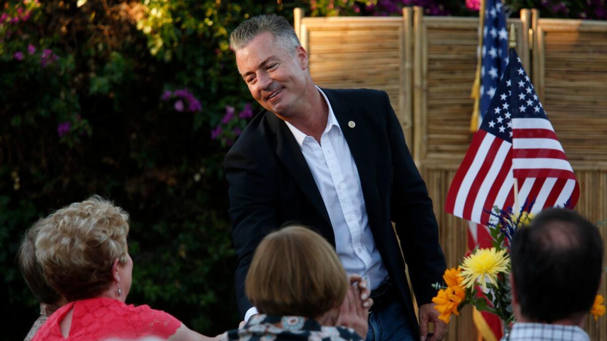 Travis Allen, a state assemblyman from Huntington Beach, greets constituents at a fundraiser for Arcadia Republicans at the home of Arcadia Mayor Peter Amundson and his wife, Jackie. Allen is running for governor of California.