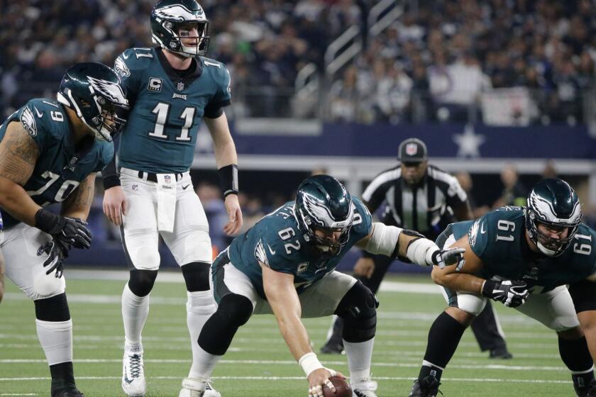 Philadelphia Eagles' Brandon Brooks (79), Carson Wentz (11), Jason Kelce (62) and Stefen Wisniewski (61) line up against the Dallas Cowboys in the second half of an NFL football game in Arlington, Texas, Sunday, Dec. 9, 2018. (AP Photo/Michael Ainsworth)