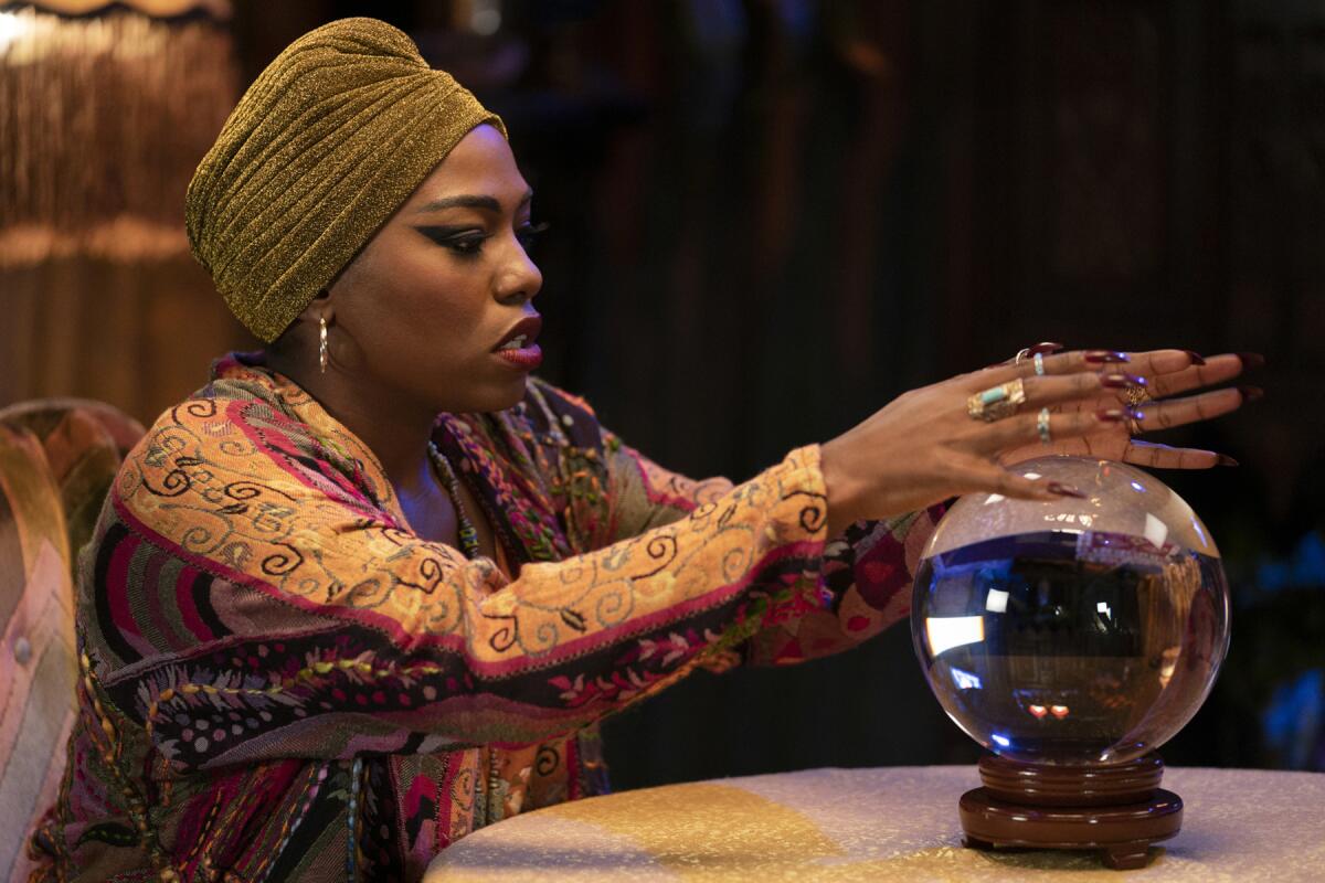Laci Mosley looks into a crystal ball as a psychic in "A Black Lady Sketch Show" on HBO.