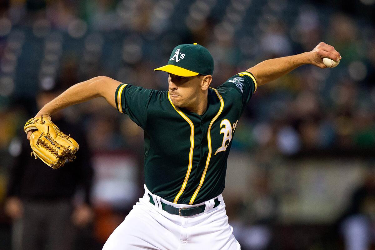 A's reliever Pat Venditte pitches against the Texas Rangers during a game June 10, 2015, in Oakland.