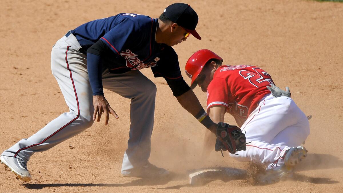 Twins shortstop appears to apply a late tag to the Angels' Ben Revere on a steal attempt in the ninth inning, but a video replay overturned the safe call and ended the game.
