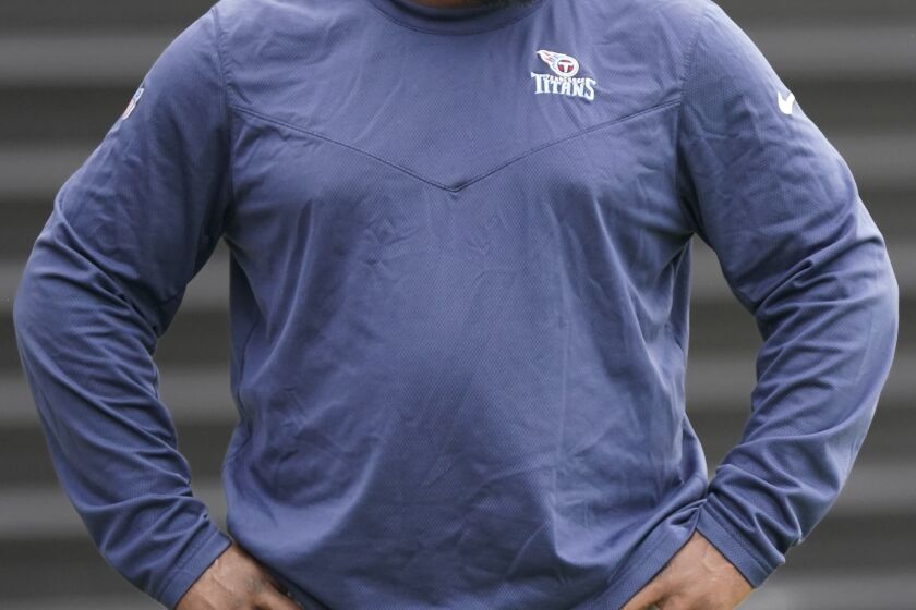Tennessee Titans general manager Ran Carthon watches from the sideline during practice at the NFL football team's training facility Thursday, June 8, 2023, in Nashville, Tenn. (AP Photo/George Walker IV)