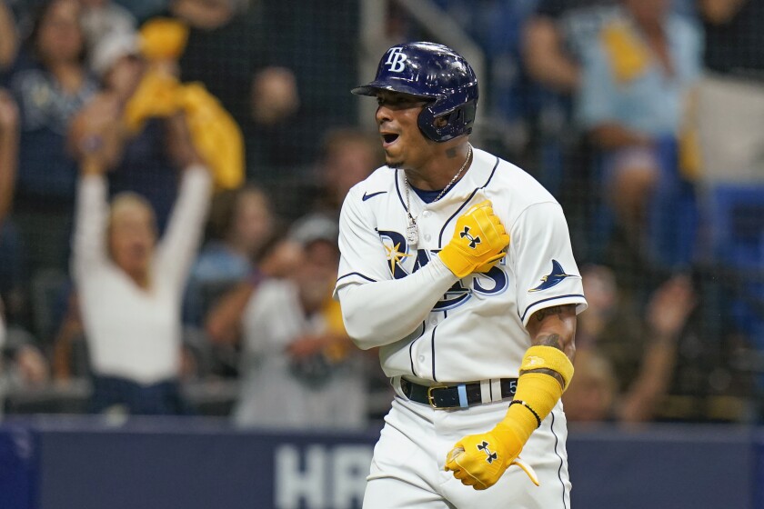 FILE - Tampa Bay Rays' Wander Franco celebrates after scoring on a single by Yandy Diaz the first inning of Game 1 of the baseball team's American League Division Series against the Boston Red Sox, on Oct. 7, 2021, in St. Petersburg, Fla. Franco and the Rays have finalized an $182 million, 11-year contract that includes a club option for the 2033 season, the team announced Saturday, Nov. 27, 2021. (AP Photo/Chris O'Meara, File_