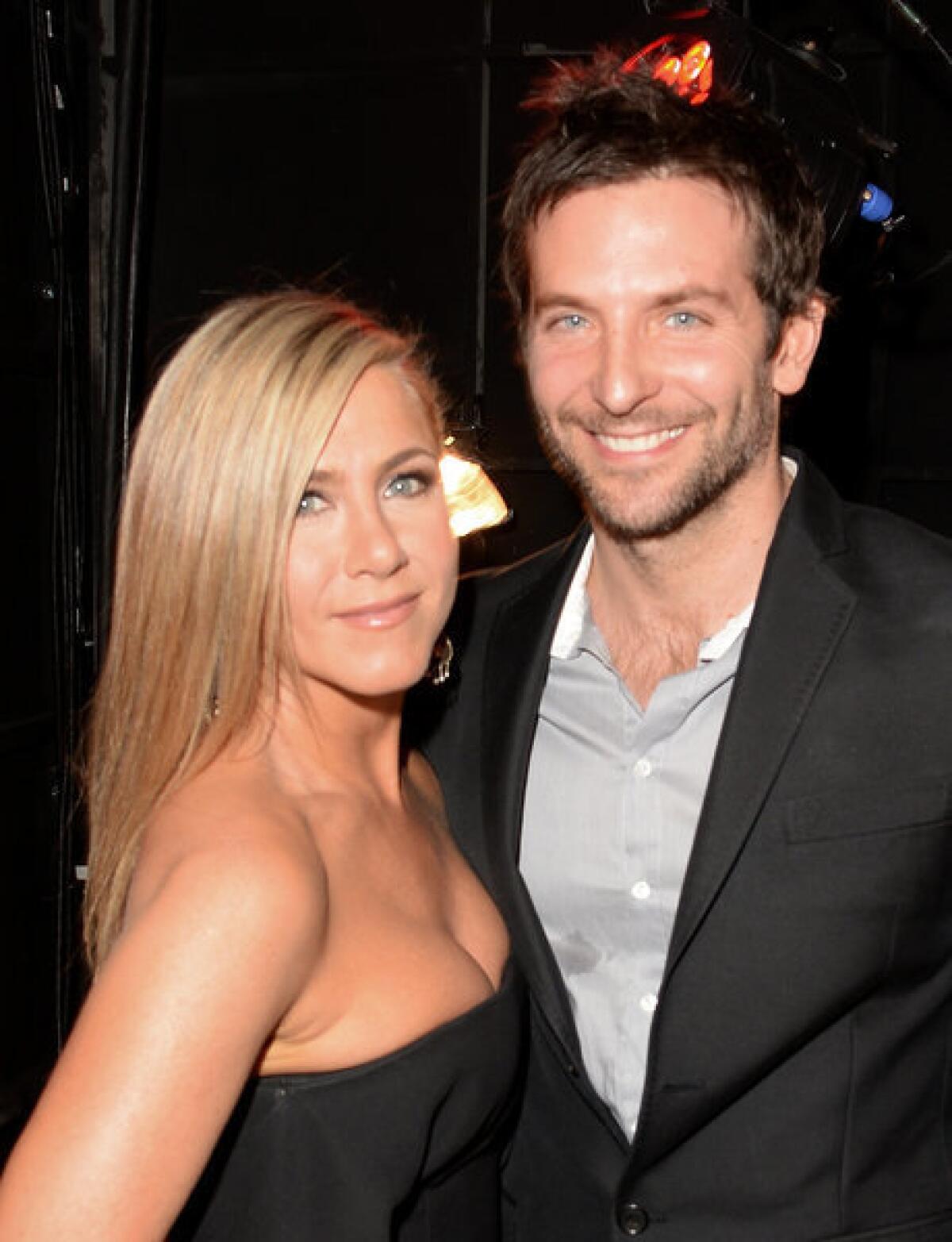 Jennifer Aniston, shown with Bradley Cooper this month at Spike TV's Guys Choice 2013 awards, will appear in Saks Fifth Avenue ads promoting a cancer-research fundraising campaign.