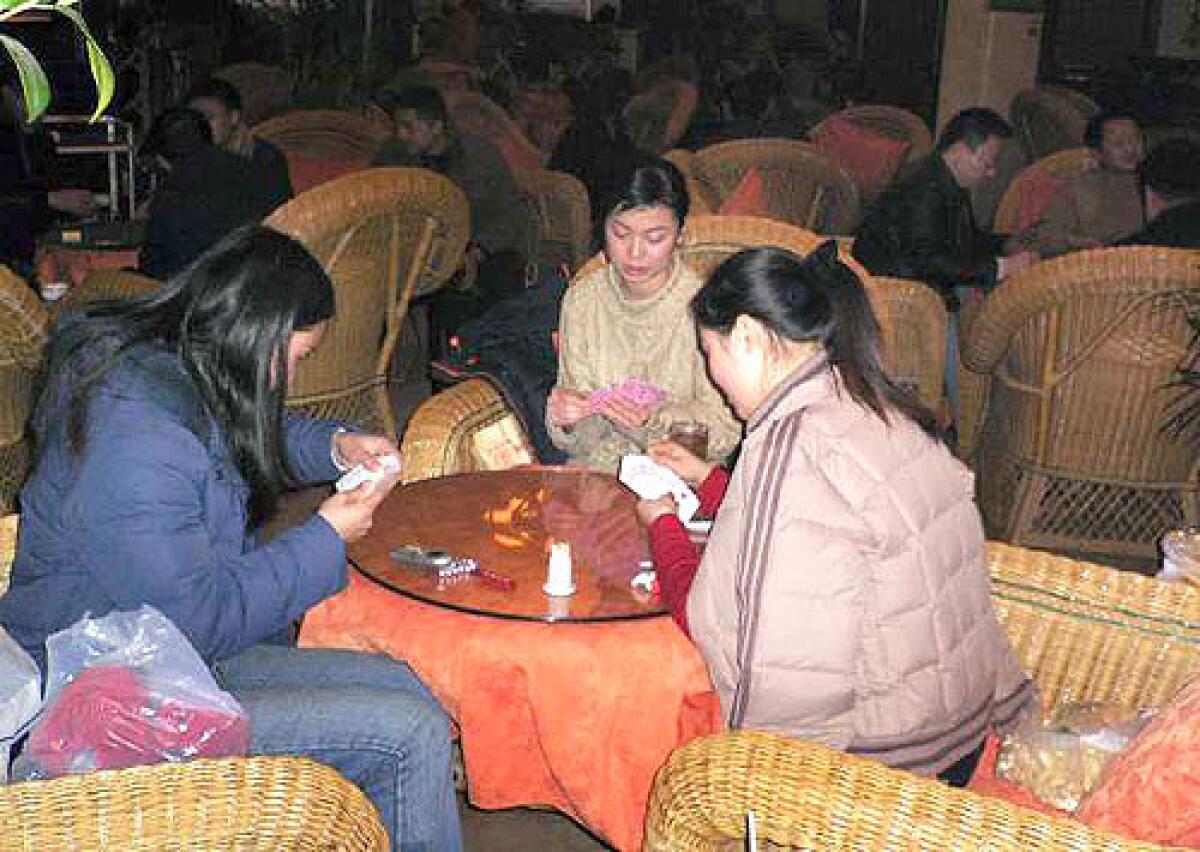 LEISURE WORLD: Unlike people in other cities, where the frantic pace of Chinas boom is evident, in Chengdu, their attitude is to get to the teahouses as soon as possible, says an American expatriate. Above, customers relax at Datang, one of the citys 4,000 teahouses.