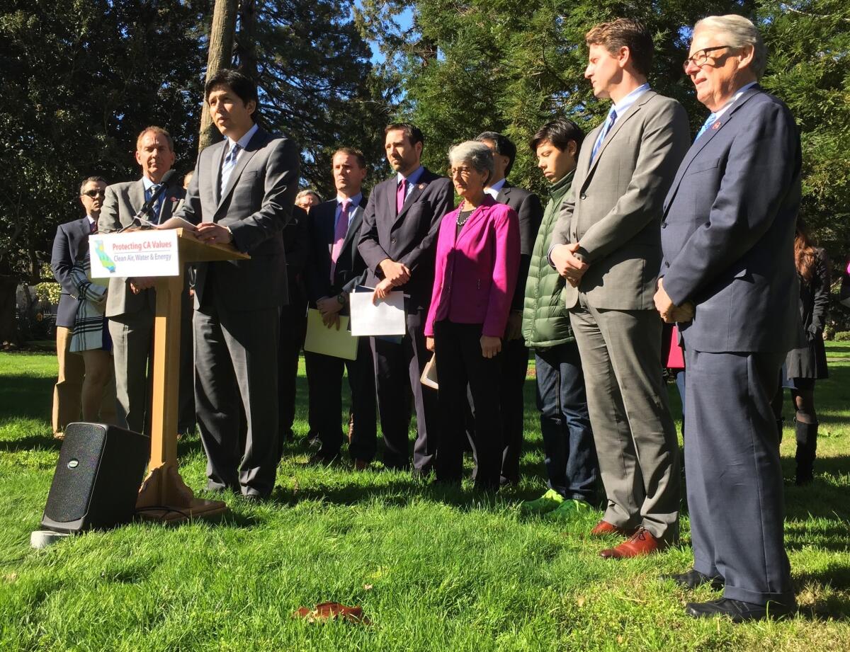 Senate leader Kevin de León, flanked by Democratic colleagues outside the Capitol, announces new environmental legislation on Thursday.