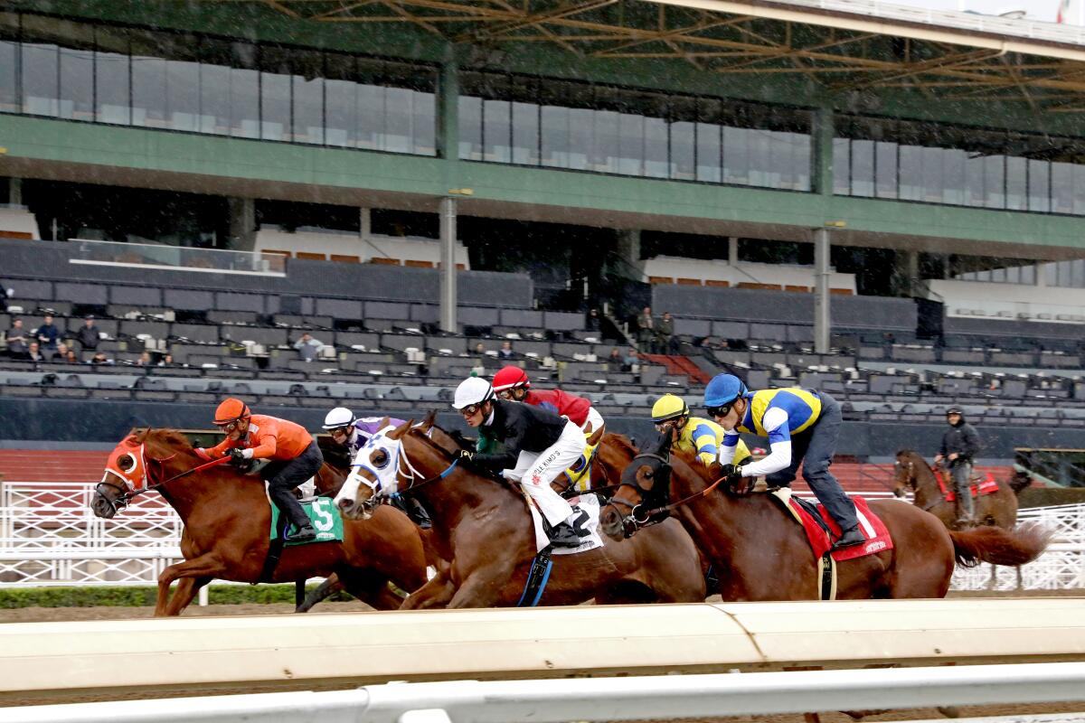 A race takes place at Santa Anita Park on March 14, 2020. 